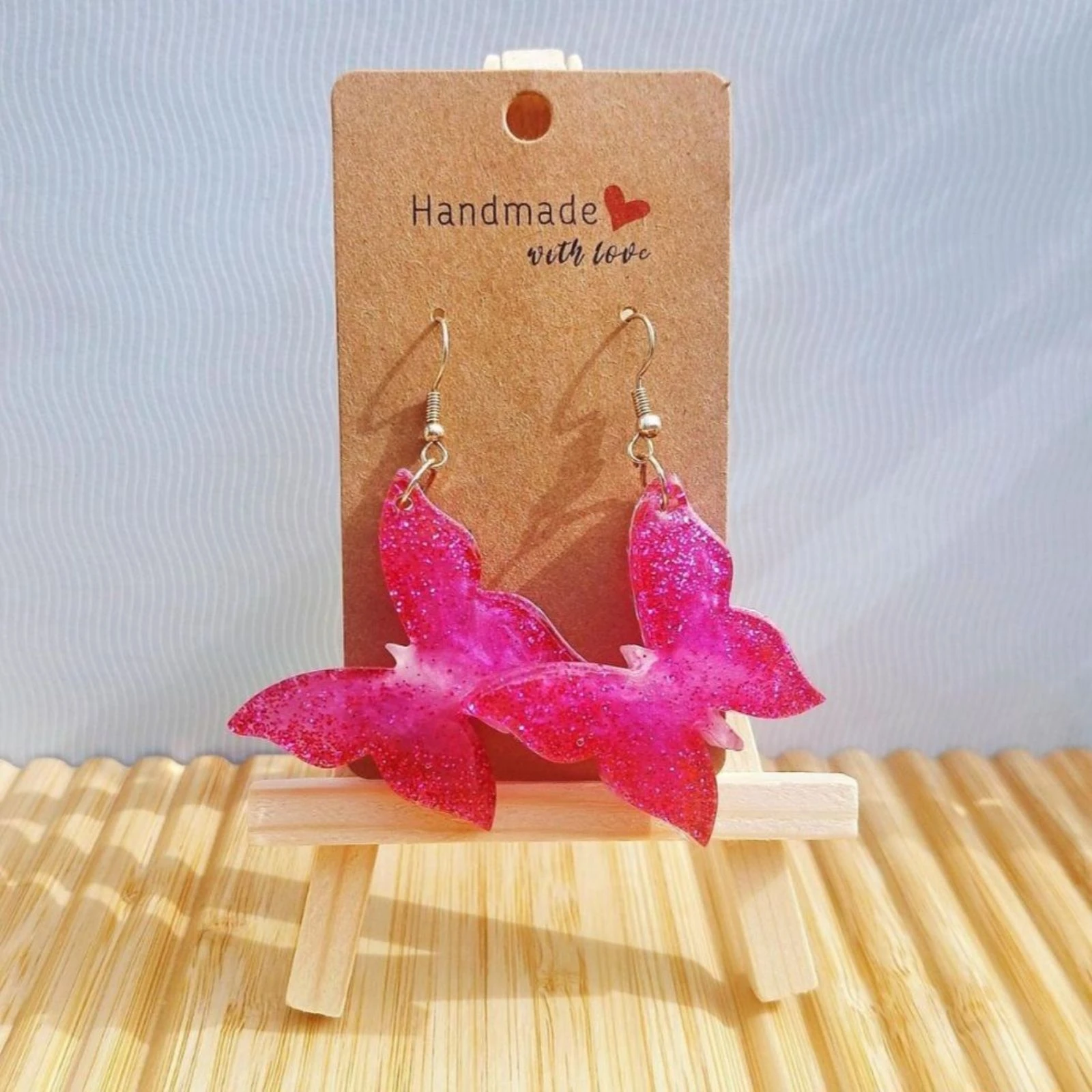 Boucles d'oreilles papillons rose 